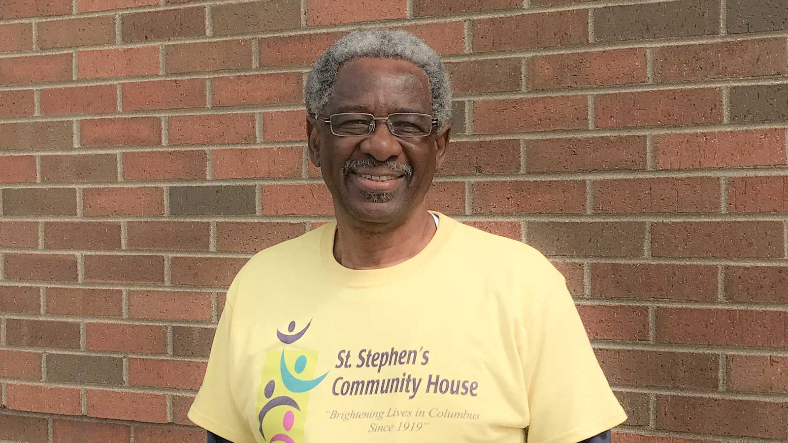 GIVE Back. GO Forward. participant volunteering at St. Stephen's Community House