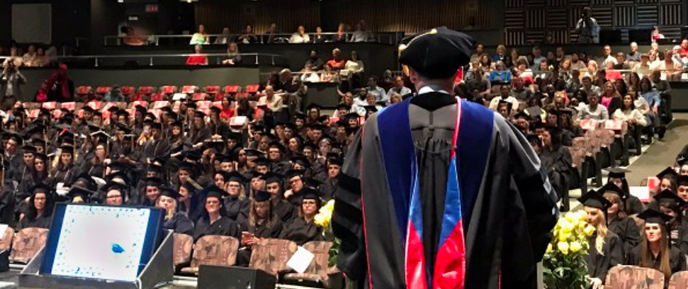 Dean Tom Gregoire speaks to the crowd in Mershon Auditorium at the College of Social Work's Evening of Recognition commencement event in May 2019