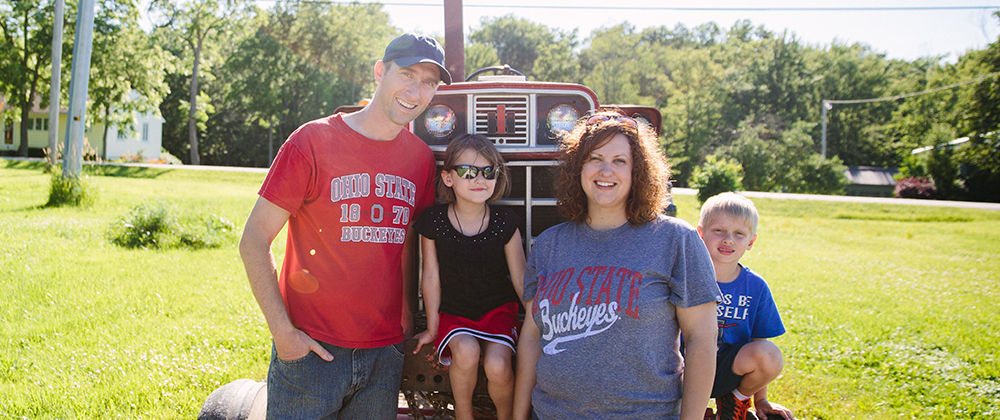 Online student Randall Moores with his family on his farm
