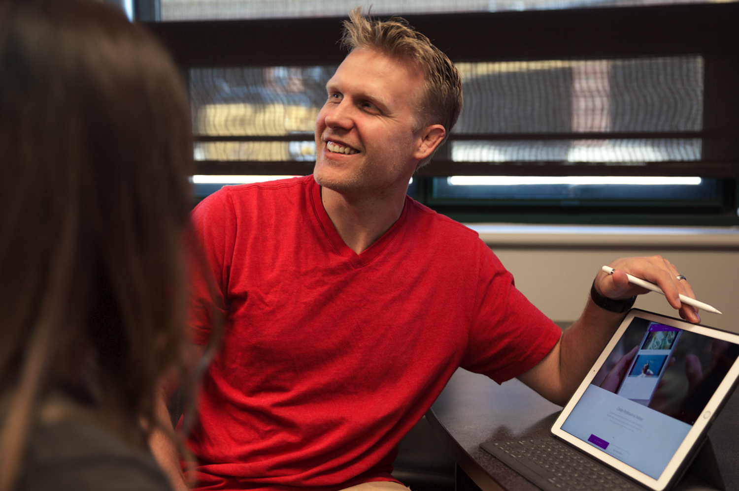 Man holding a tablet and smiling