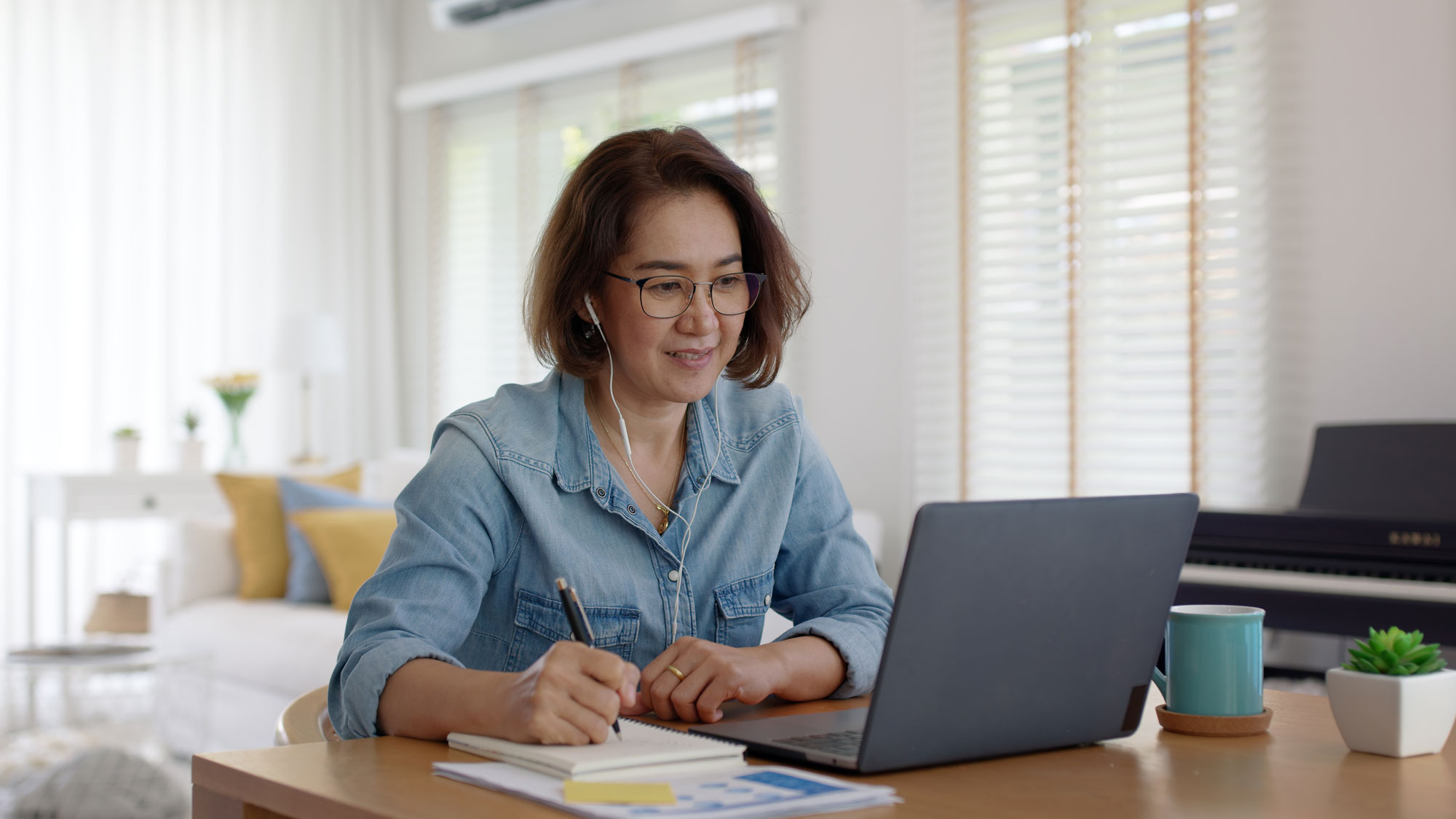Person using laptop in home office