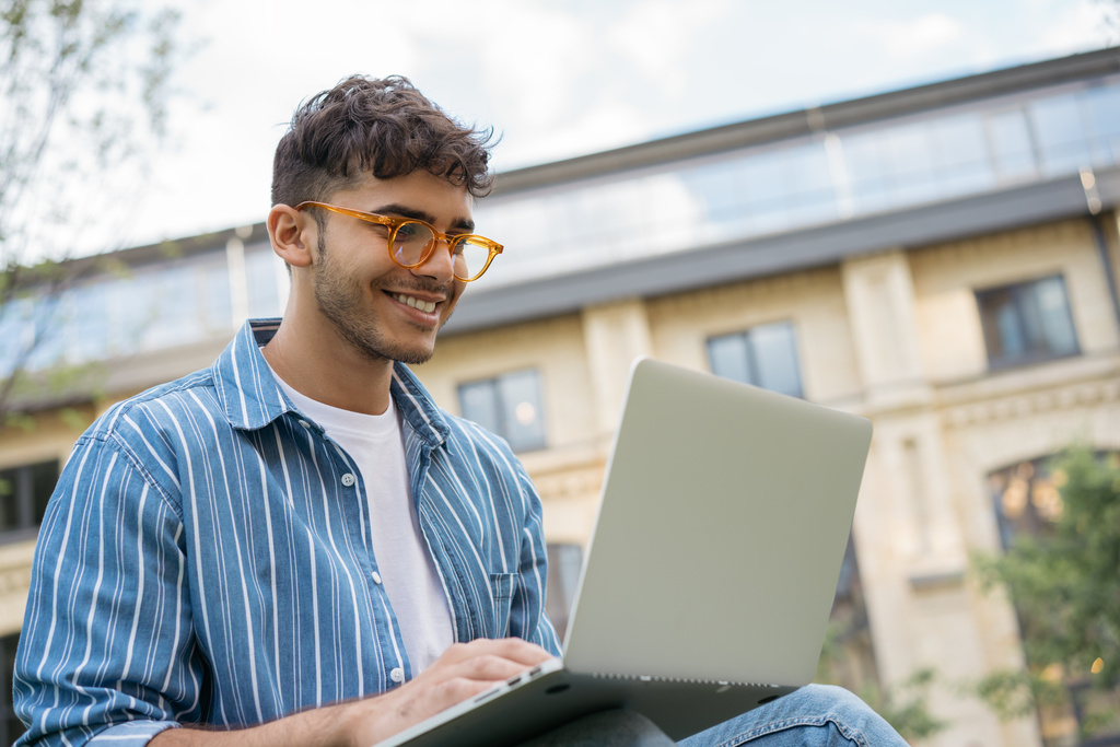 Person working on laptop outside