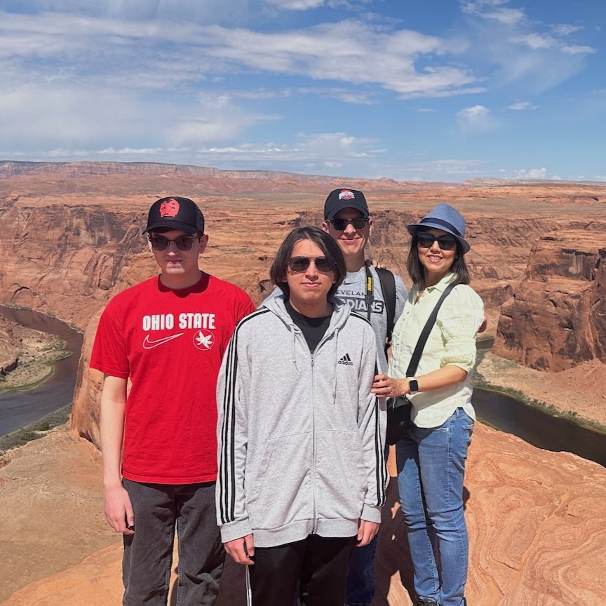 Israt with her two sons and husband visiting the Grand Canyon.