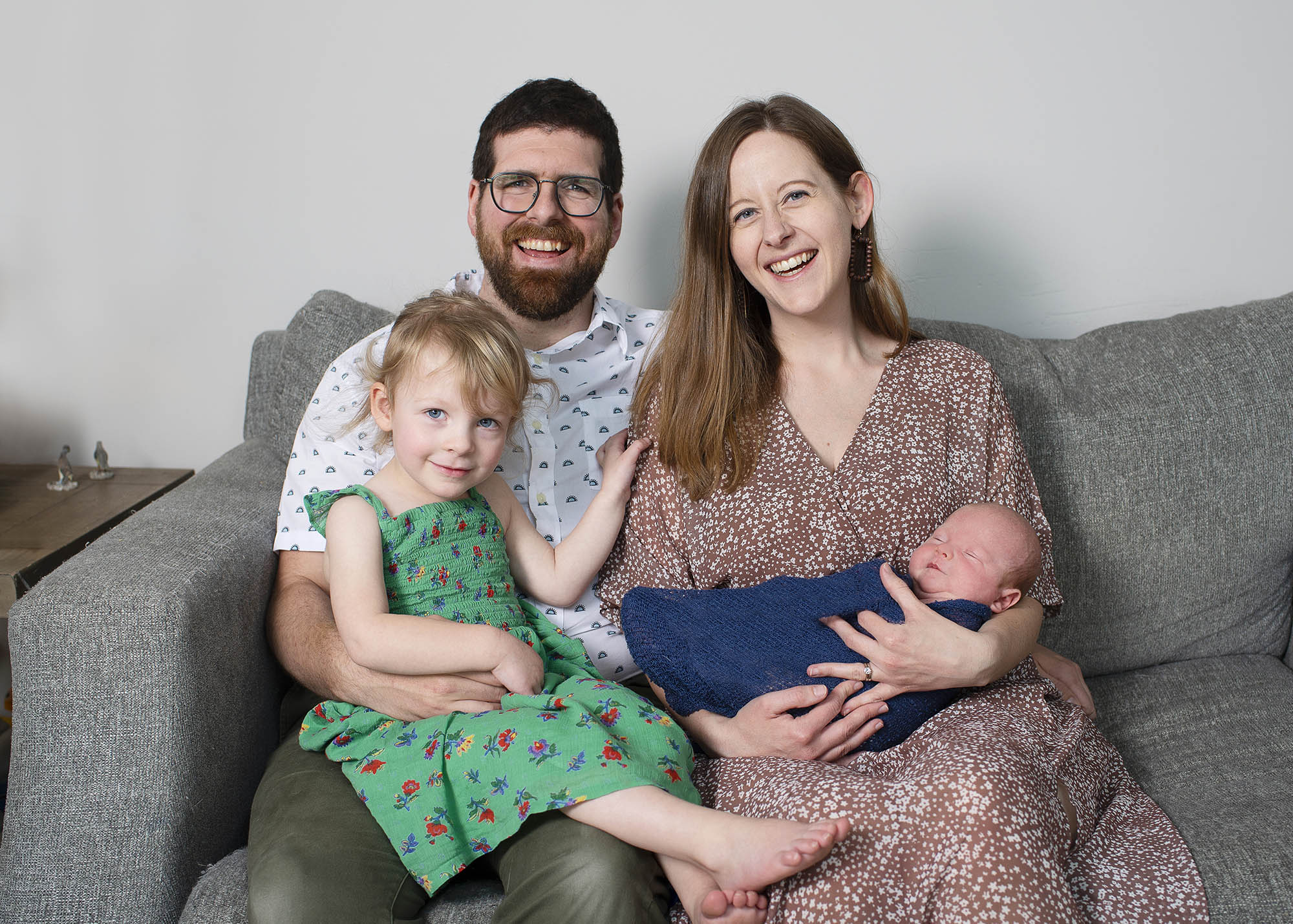 Pierre and his wife Stephanie smile while holding their children, Luna and Arthur.