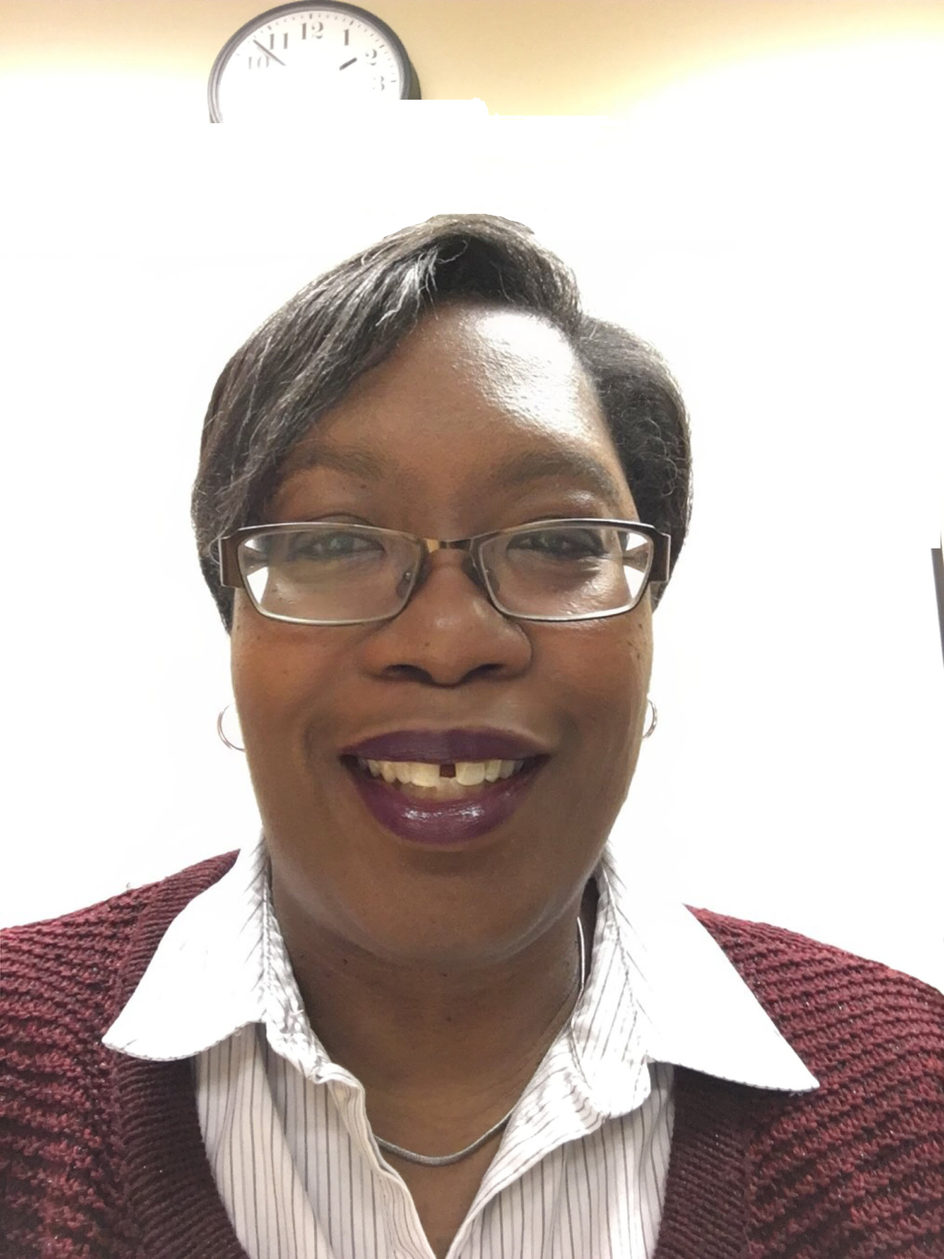 Tracey smiles for a professional headshot