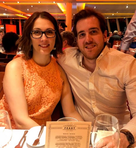 Aimee and her husband enjoy a fancy meal on a recent cruise