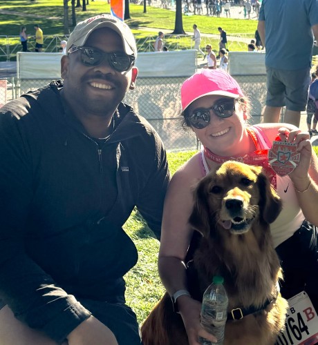 Drarelle with his wife Melanie and their golden retriever Lincoln