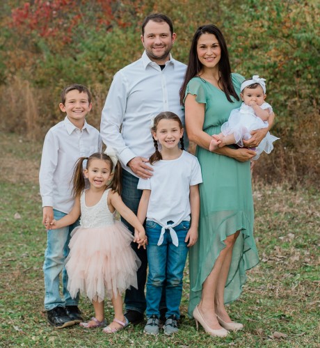 Dietrich and wife Tamara pose with their four children.