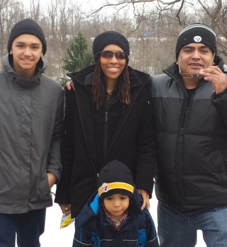 Richelle, her husband, and two sons enjoy a snowy day