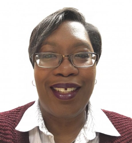 Tracey smiles for a professional headshot