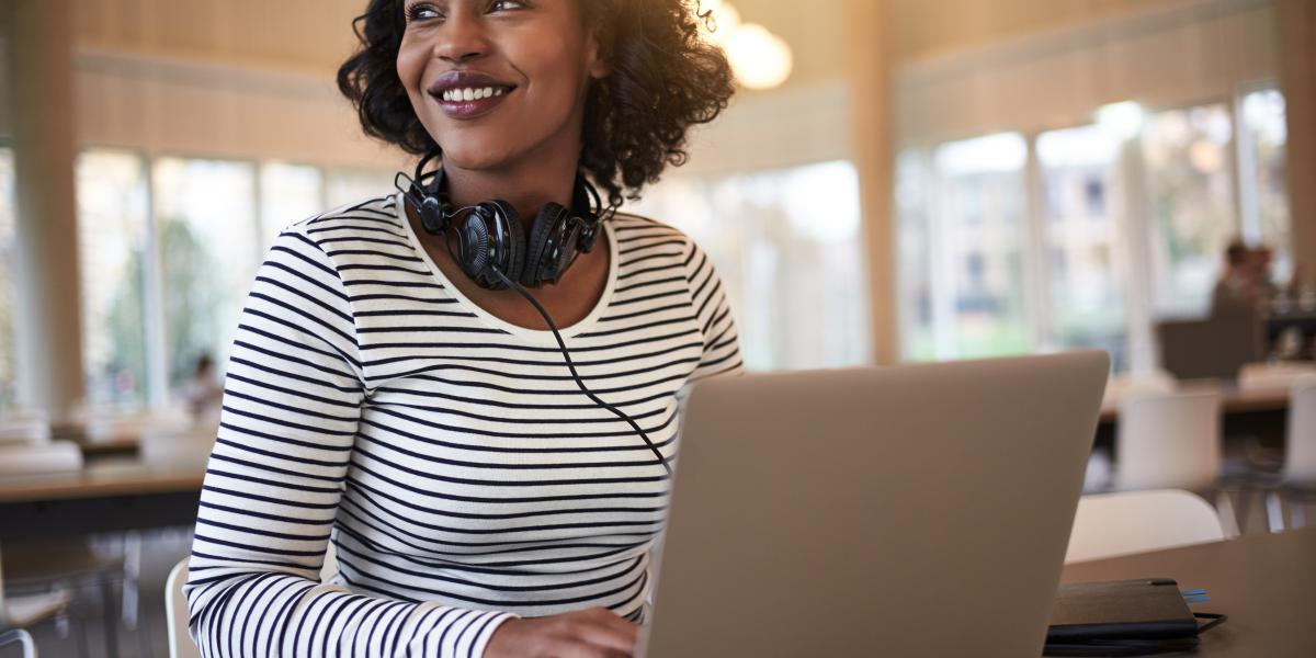 smiling student with laptop