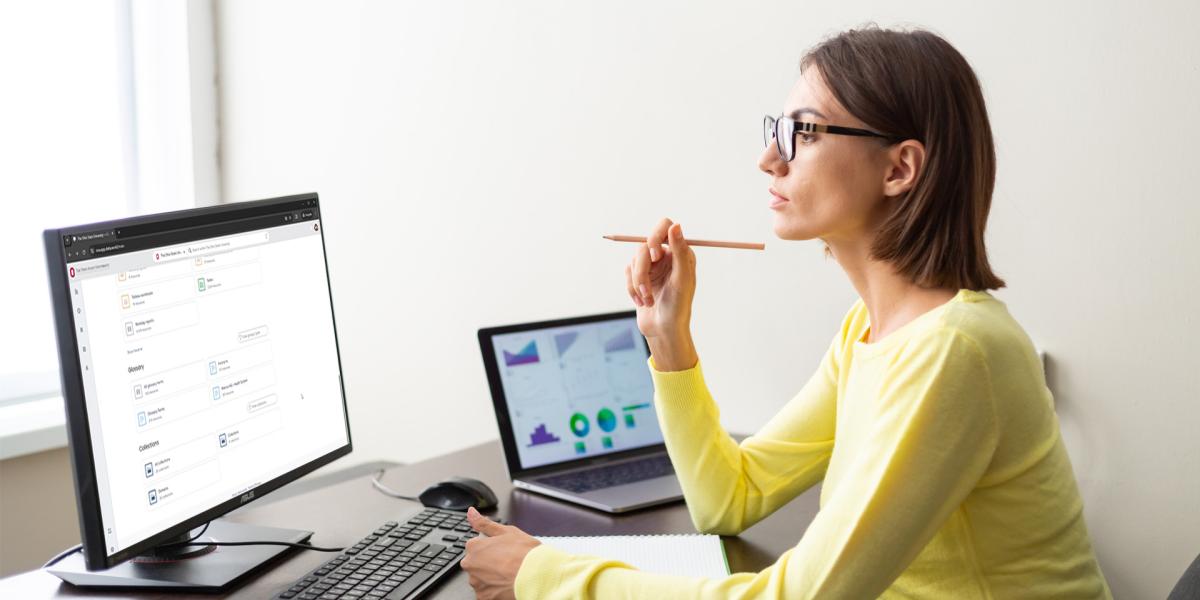 Woman looking at the data catalog on a desktop computer