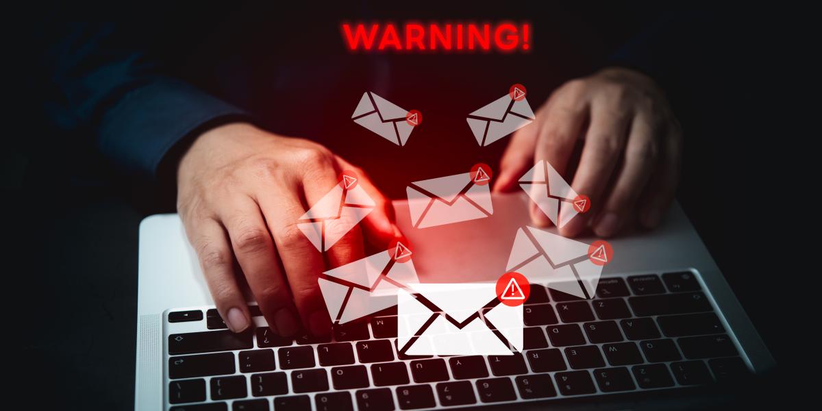 hacker typing on laptop