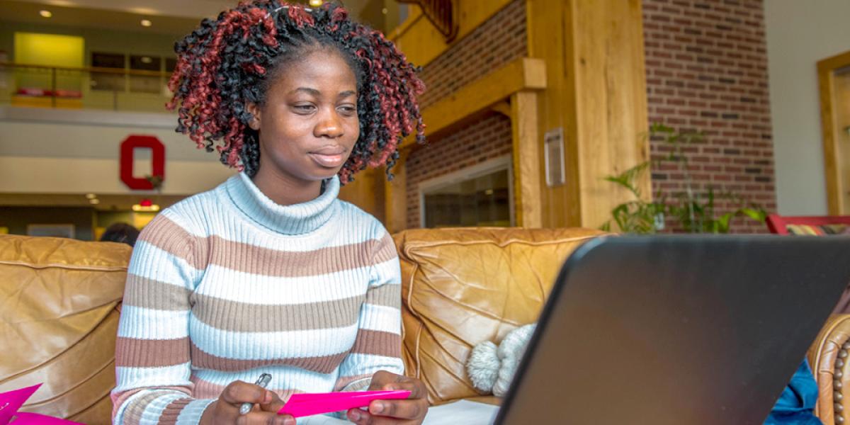 Student taking online course on laptop