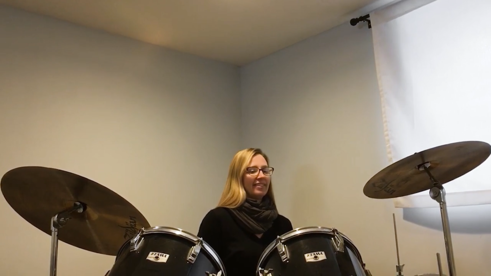 Instructor Kim Young plays the drums for her students.