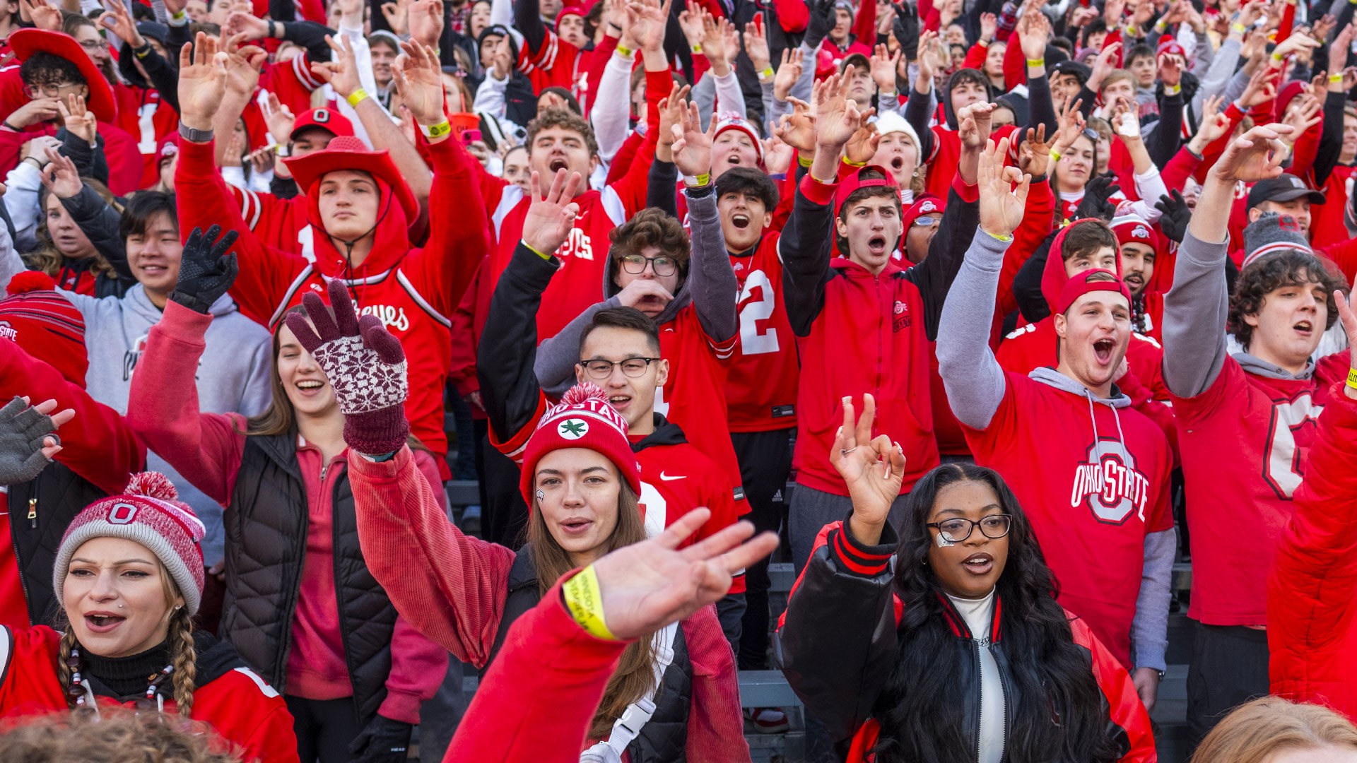 Ohio State students wearing Ohio State clothing in the student section during a football game