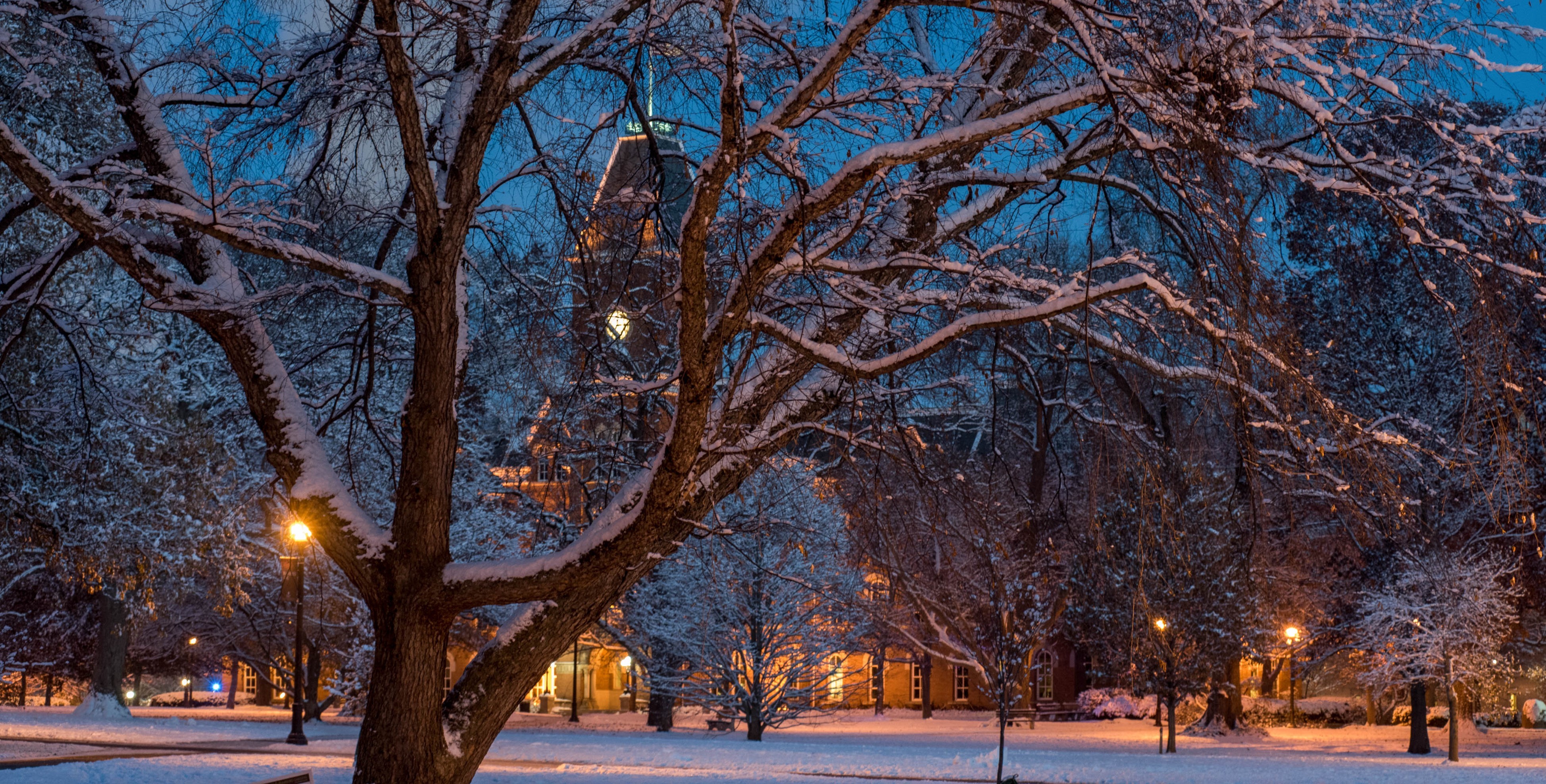 decorative image of University Hall covered in snow