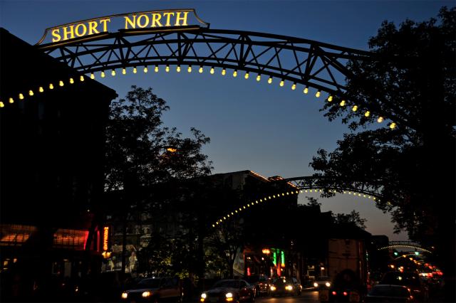 Short North illuminated entrance sign on an arch over a street