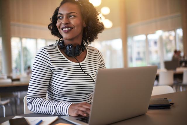 smiling student with laptop