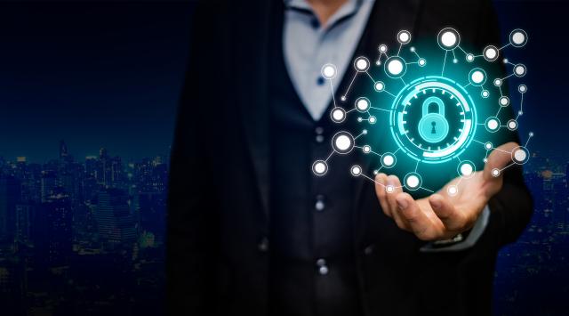 decorative image of a man holding cybersecurity device