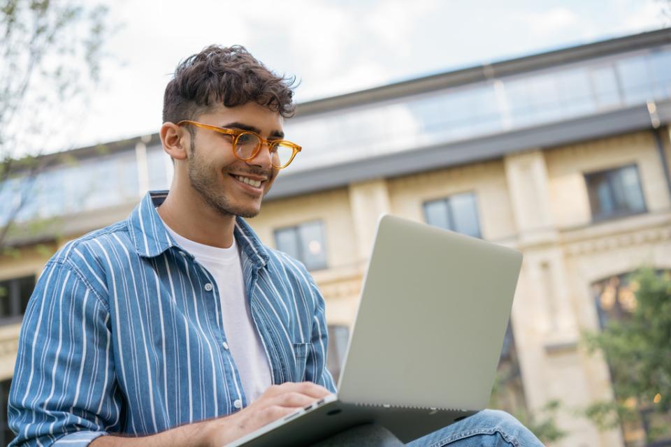 Person working on laptop outside