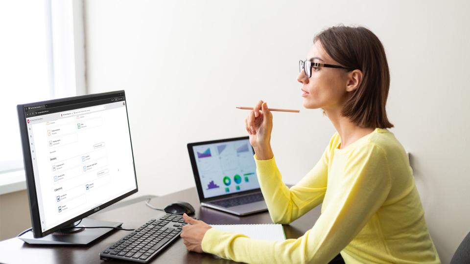 Woman looking at the data catalog on a desktop computer