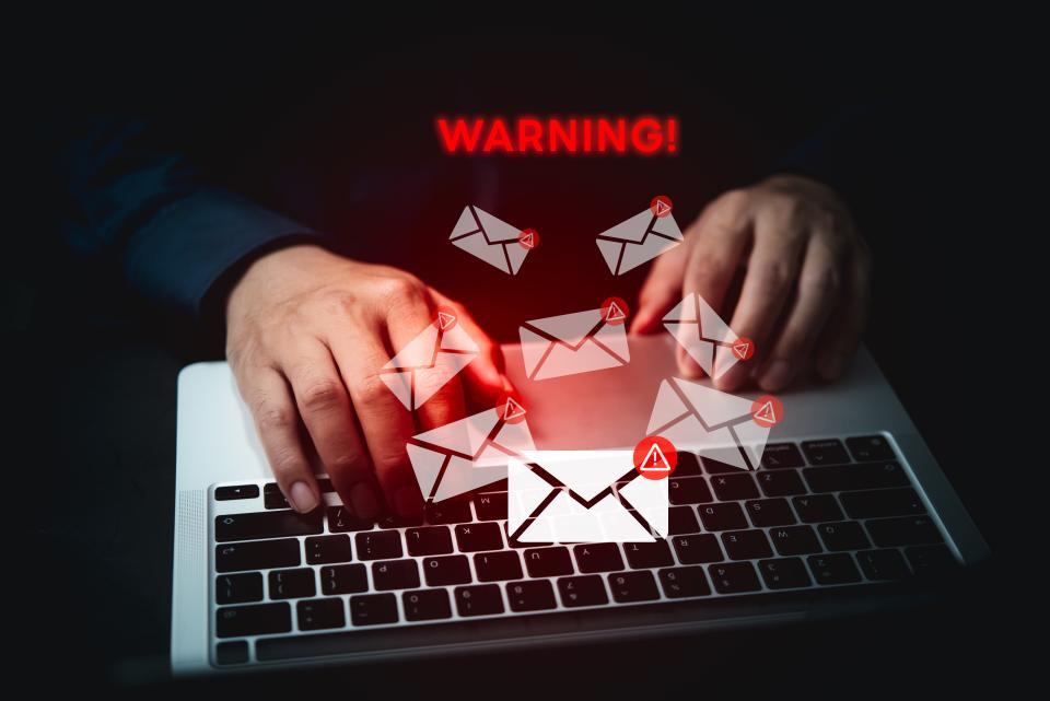 hacker typing on laptop