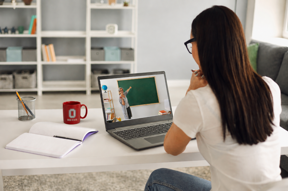 student in remote class with laptop