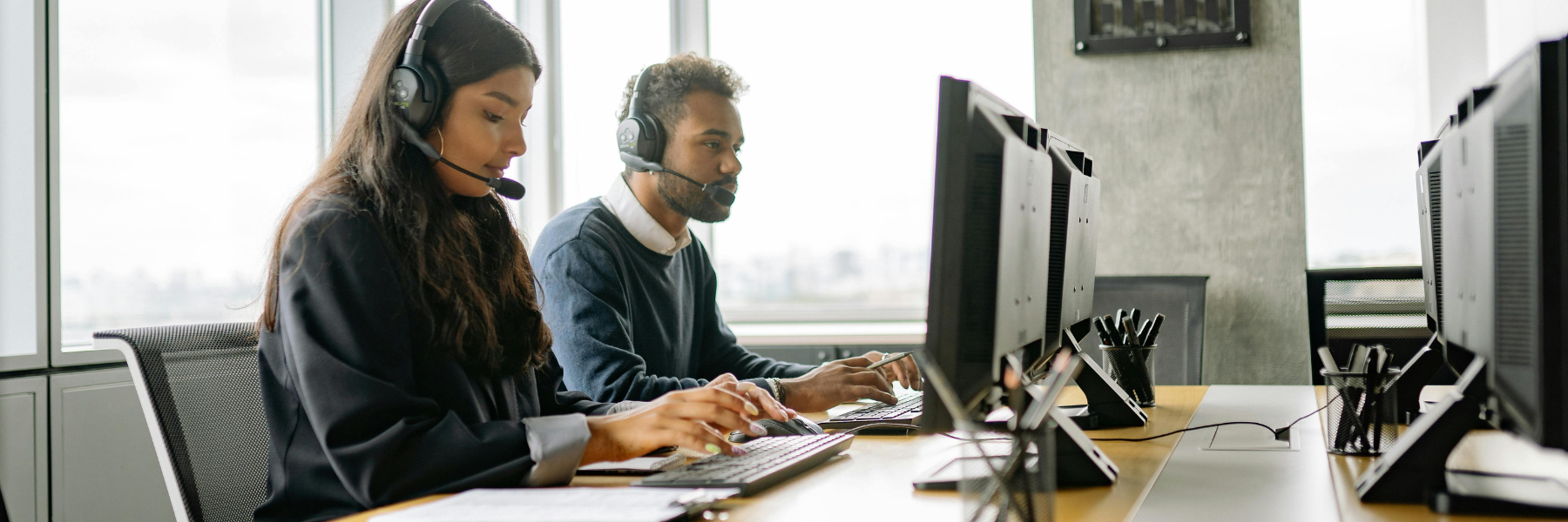 A Man and Woman Working in the Call Center Together